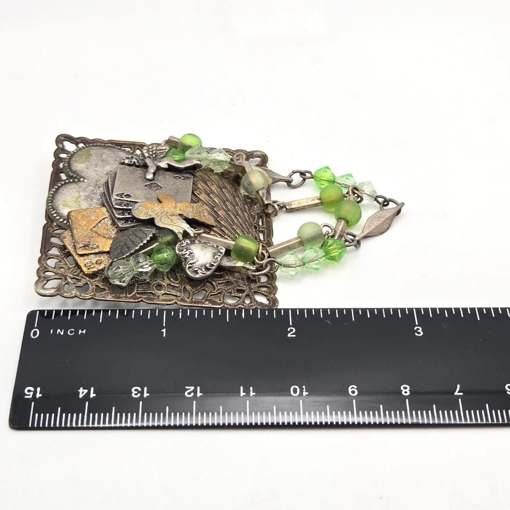 Mixed Metal Assemblage Brooch Cherub Heart Playing Cards Green Glass Bead Dangle